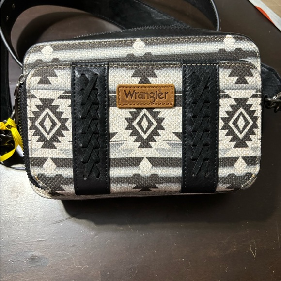 Wrangler Handbags - NWT! Wrangler small crossbody purse. Small wallet compartment on front of purse.